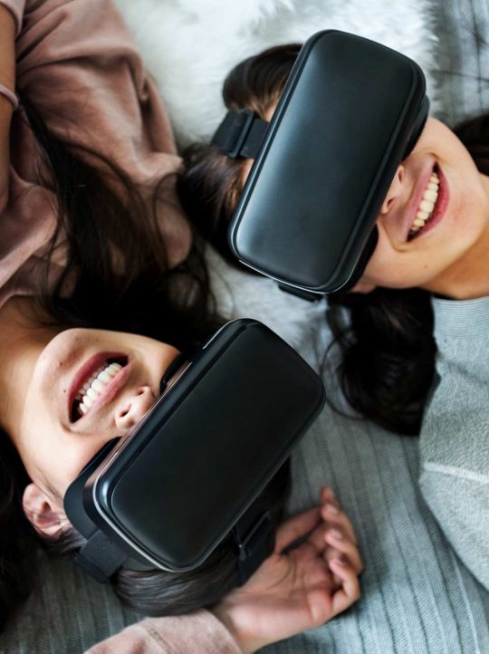 women-experiencing-virtual-reality-with-vr-headset-P8EWPYR.jpg